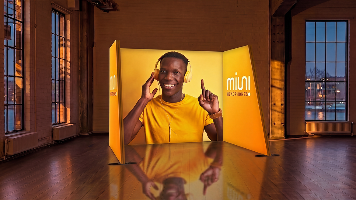Illuminated exhibition stand in an event hall
